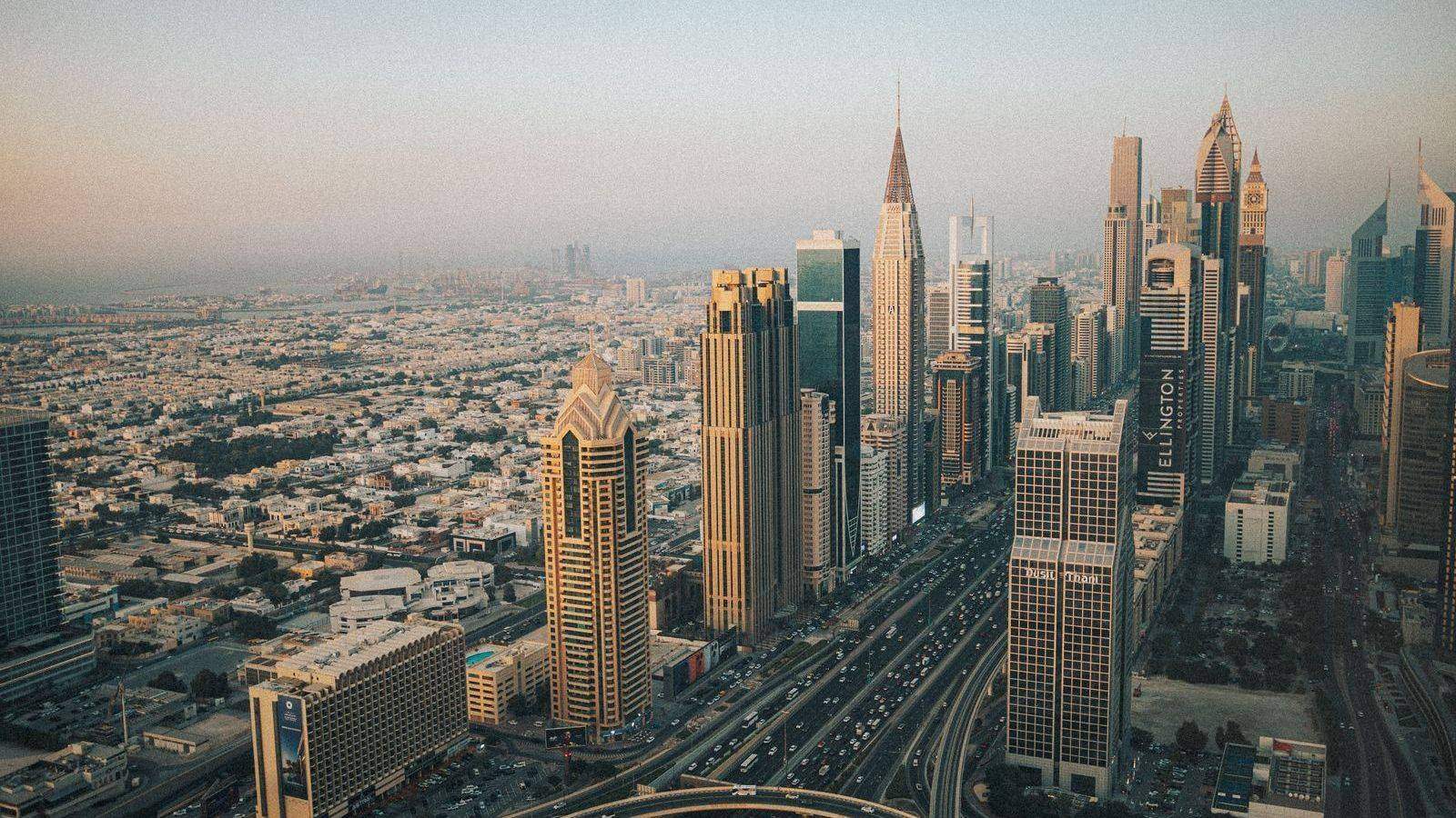 Aerial view of Dubai's skyline at dusk, UAE free zone business district