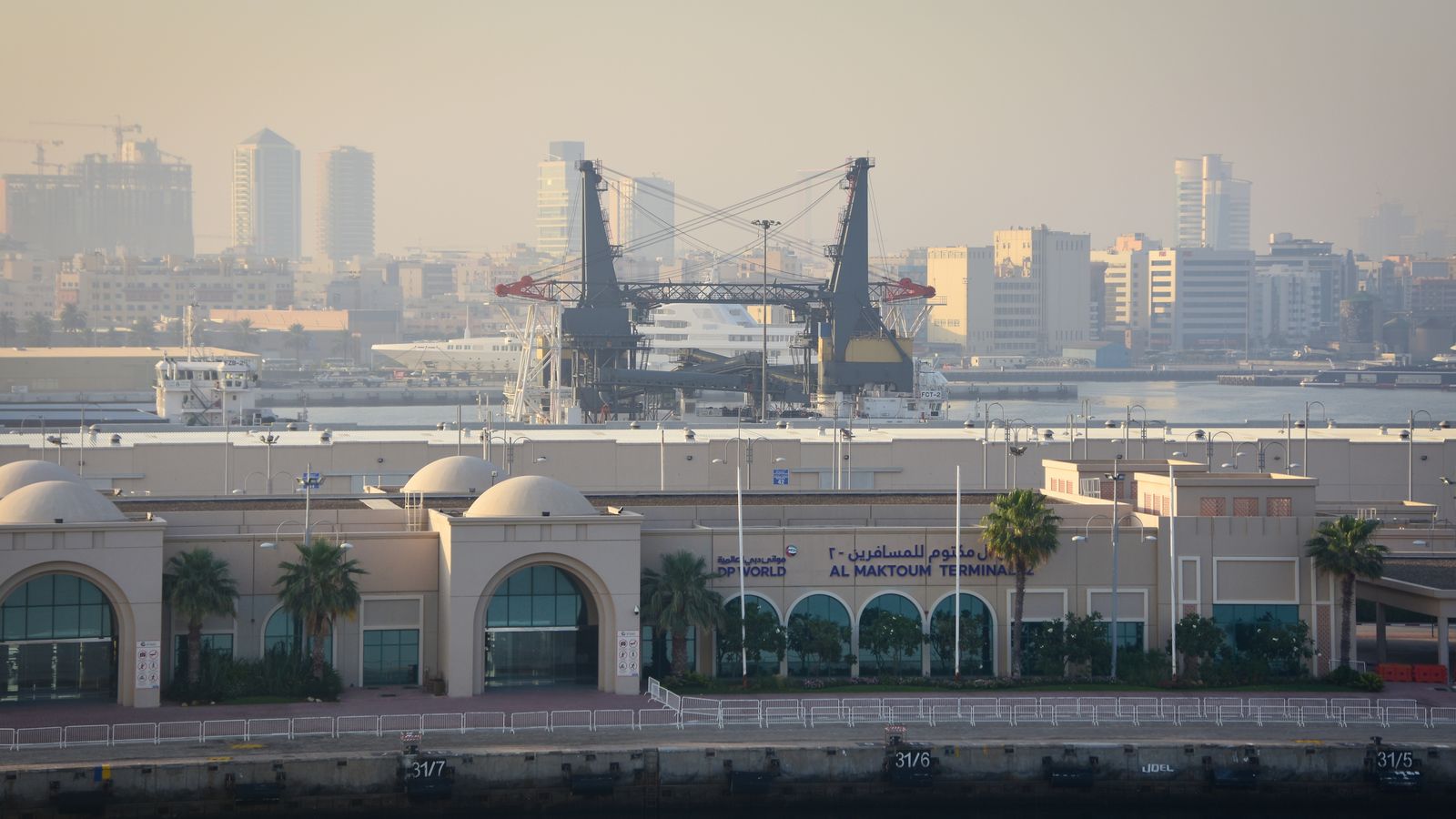 Al Maktoum Terminal with the Dubai, UAE skyline, near the JAFZA free zone