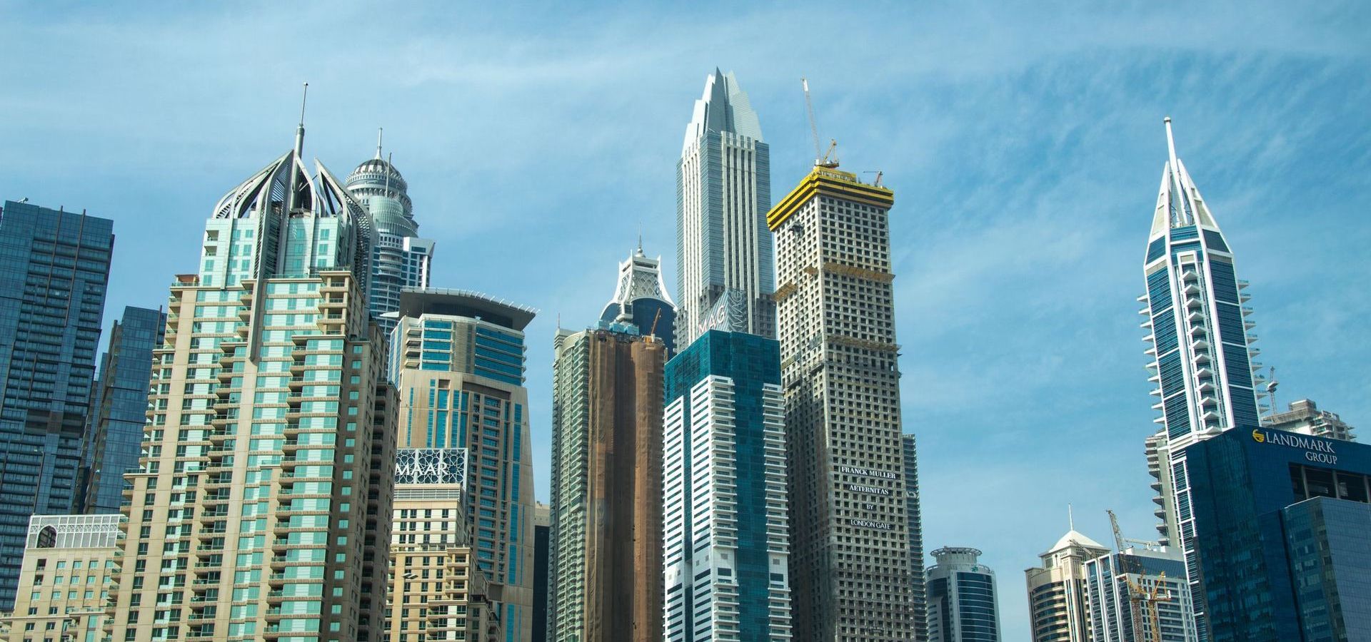 Modern Dubai Marina skyscrapers against a clear sky, representing UAE company incorporation